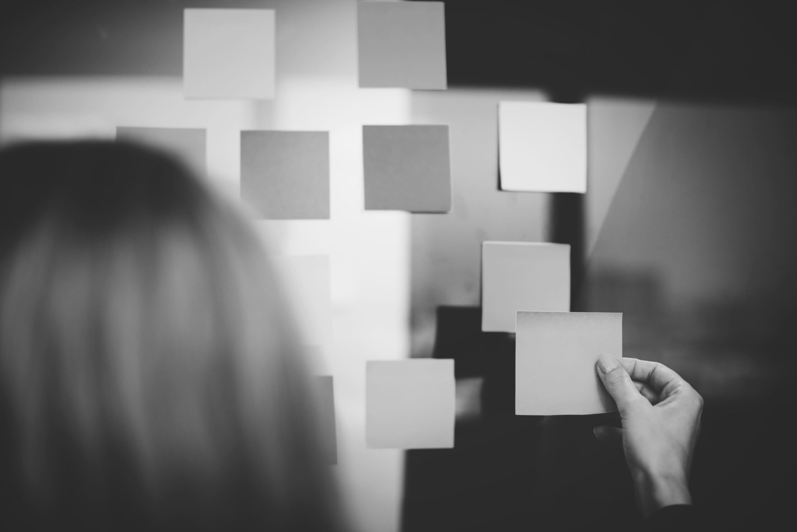 woman-attaching-note-board (1) (1)